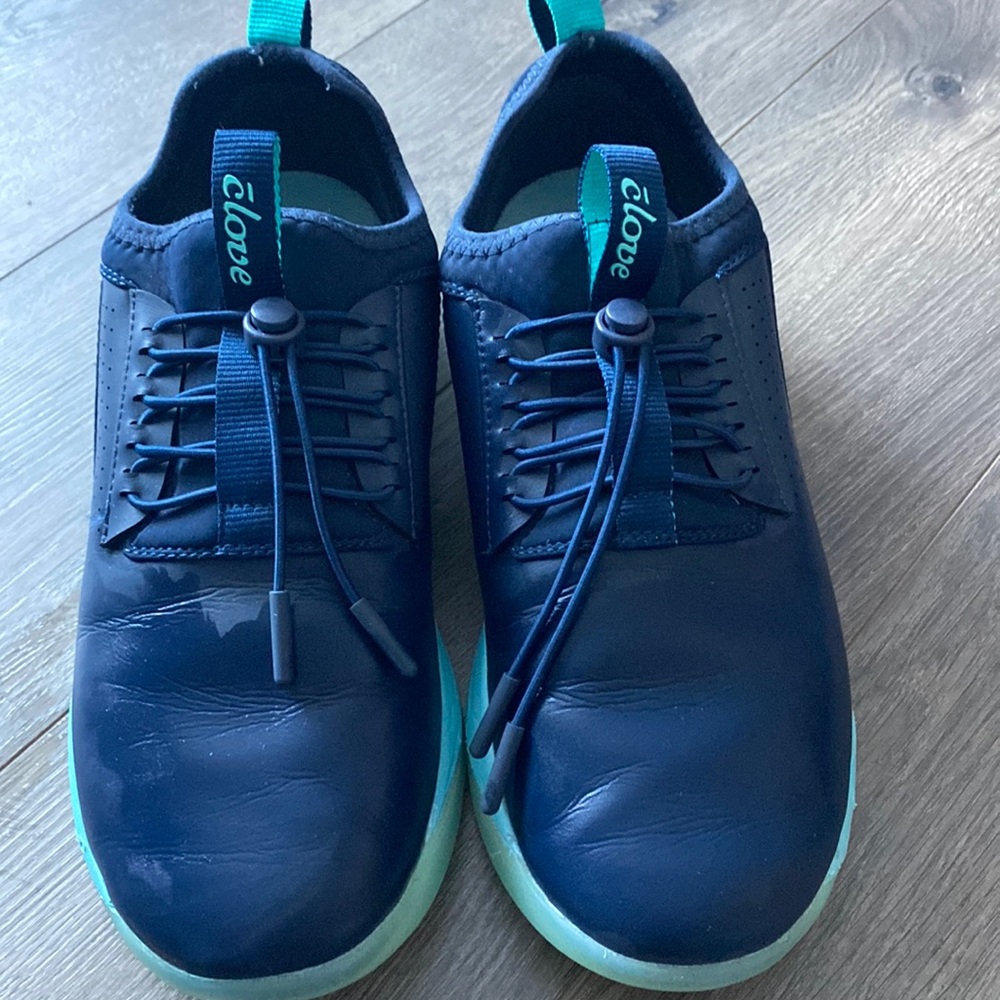 Clove shoes. Dark blue with aqua blue soles and trim. Spill resistant.